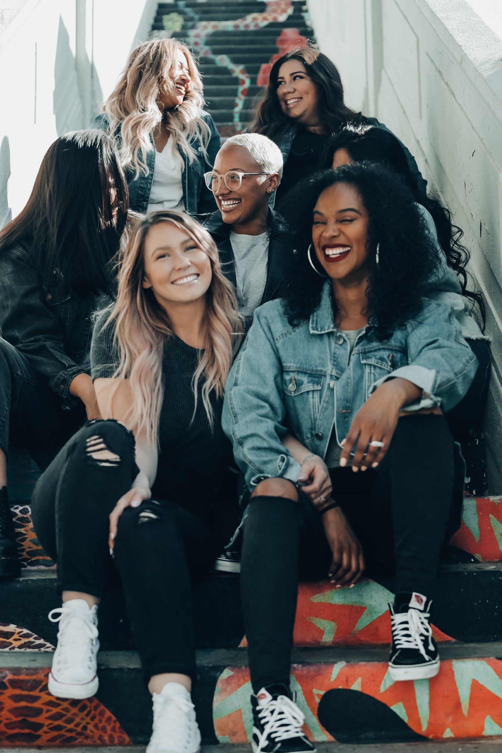 Group of women sitting on steps